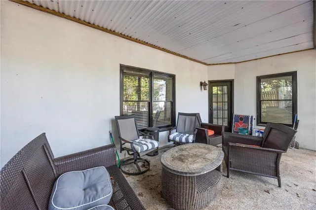 an aerial view of a house with a swimming pool