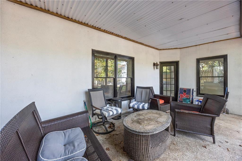 3420 Millwater Crossing Northeast Dacula, GA 30019 - Photo 39 of 54 a living room with furniture and a window