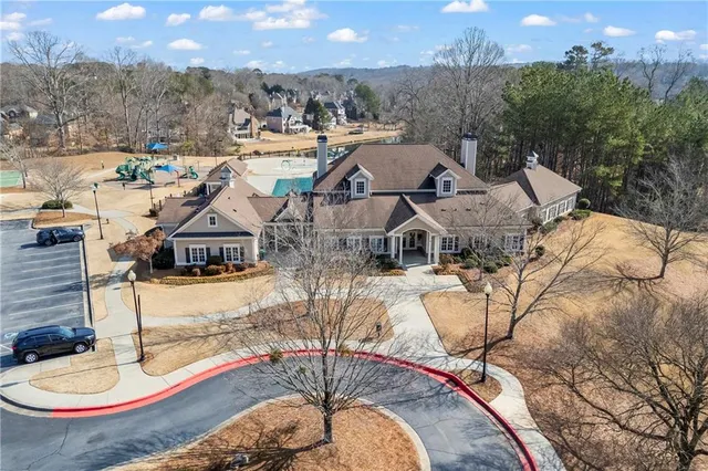 an aerial view of a house with garden space and street view