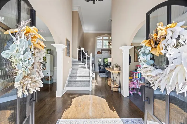 a view of entryway with wooden floor
