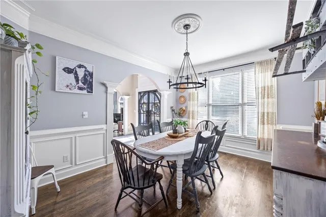 a view of a dining room with furniture window and wooden floor