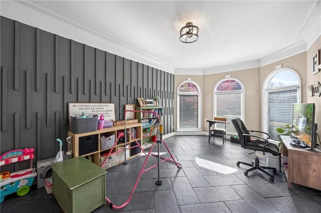 a living room with furniture a rug and a window