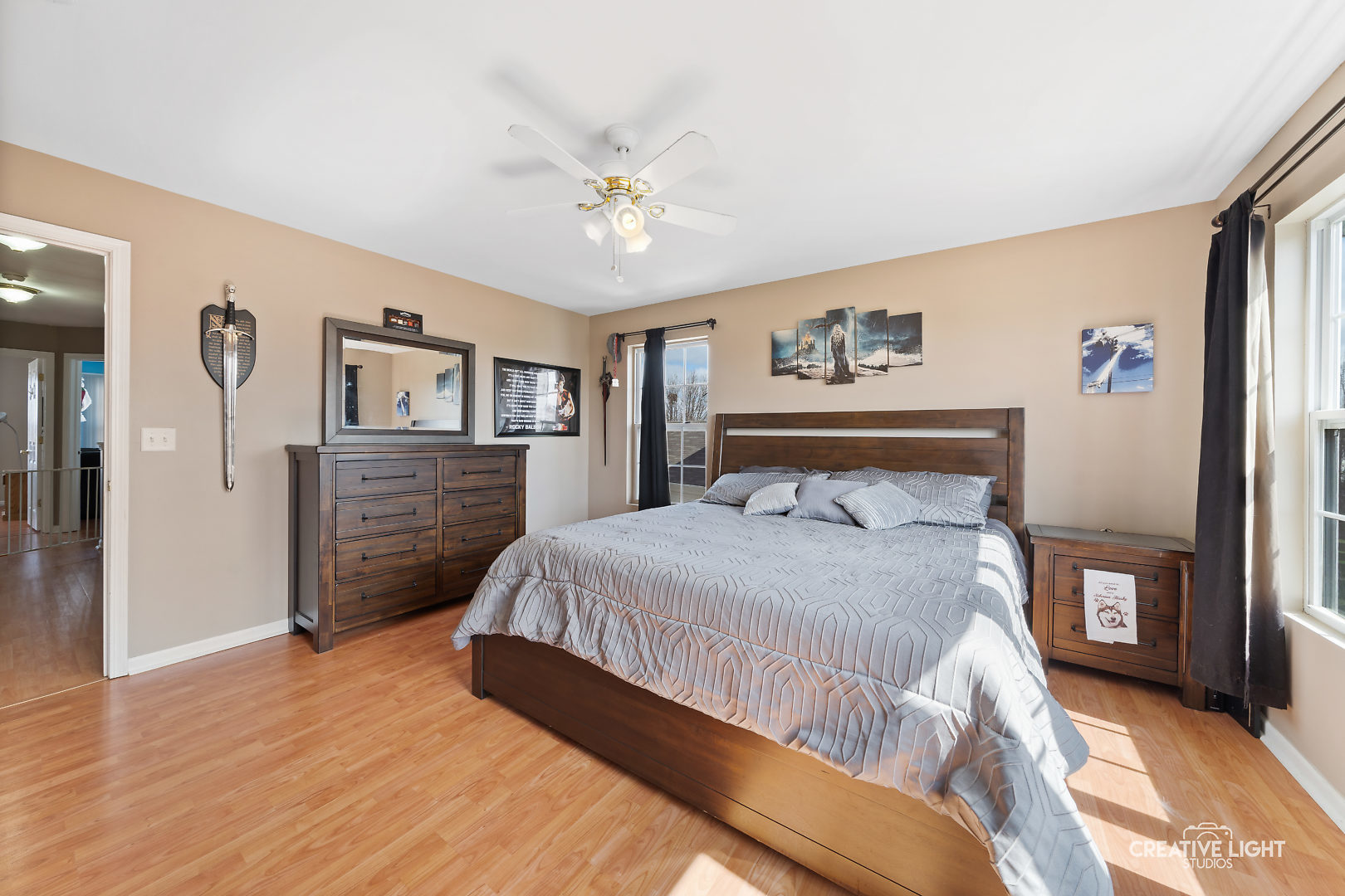 1987 West Cobblestone Road Romeoville, IL 60446 - Photo 13 of 20 a spacious bedroom with a bed and a chandelier