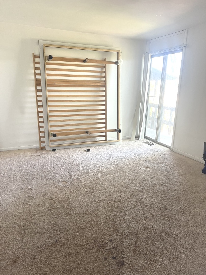 1601 Maple Terrace, Unit 3B Lisle, IL 60532 - Photo 7 of 9 an empty room with a window