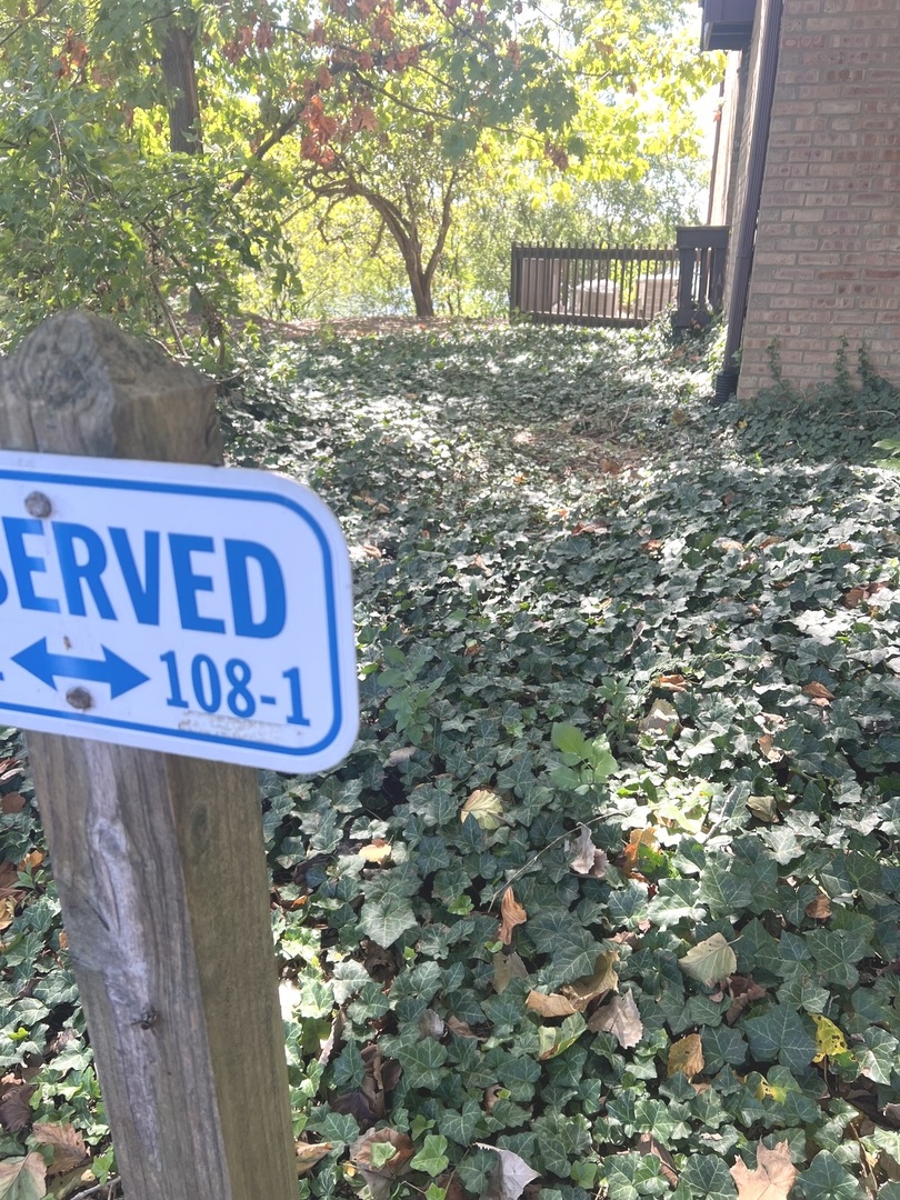 1601 Maple Terrace, Unit 3B Lisle, IL 60532 - Photo 9 of 9 a sign broad in front of it