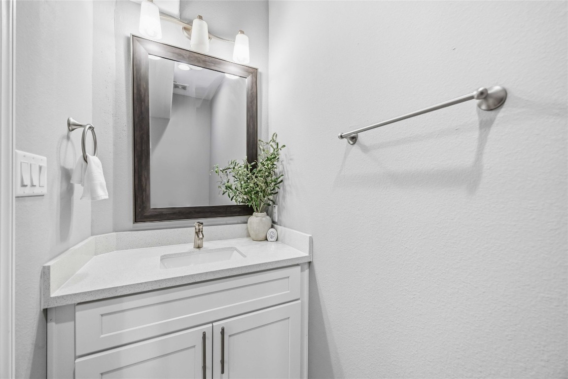 4903 Mallow Street, Unit A Houston, TX 77033 - Photo 4 of 10 a bathroom with a sink and a mirror
