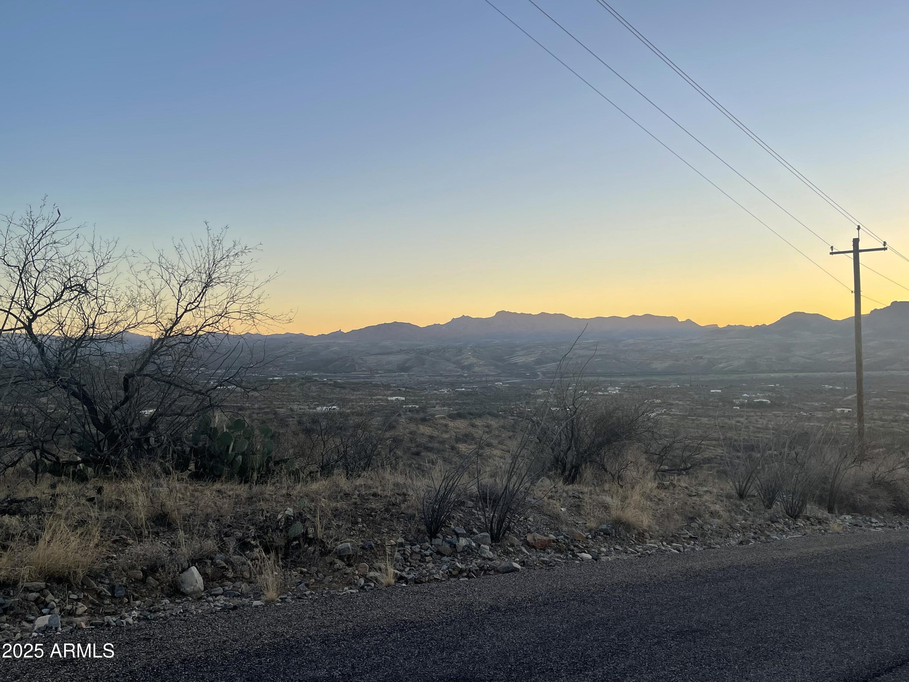 1742 Ruta Caravela, Unit 10 Rio Rico, AZ 85648 - Photo 5 of 8 a view of a dry yard with wooden fence