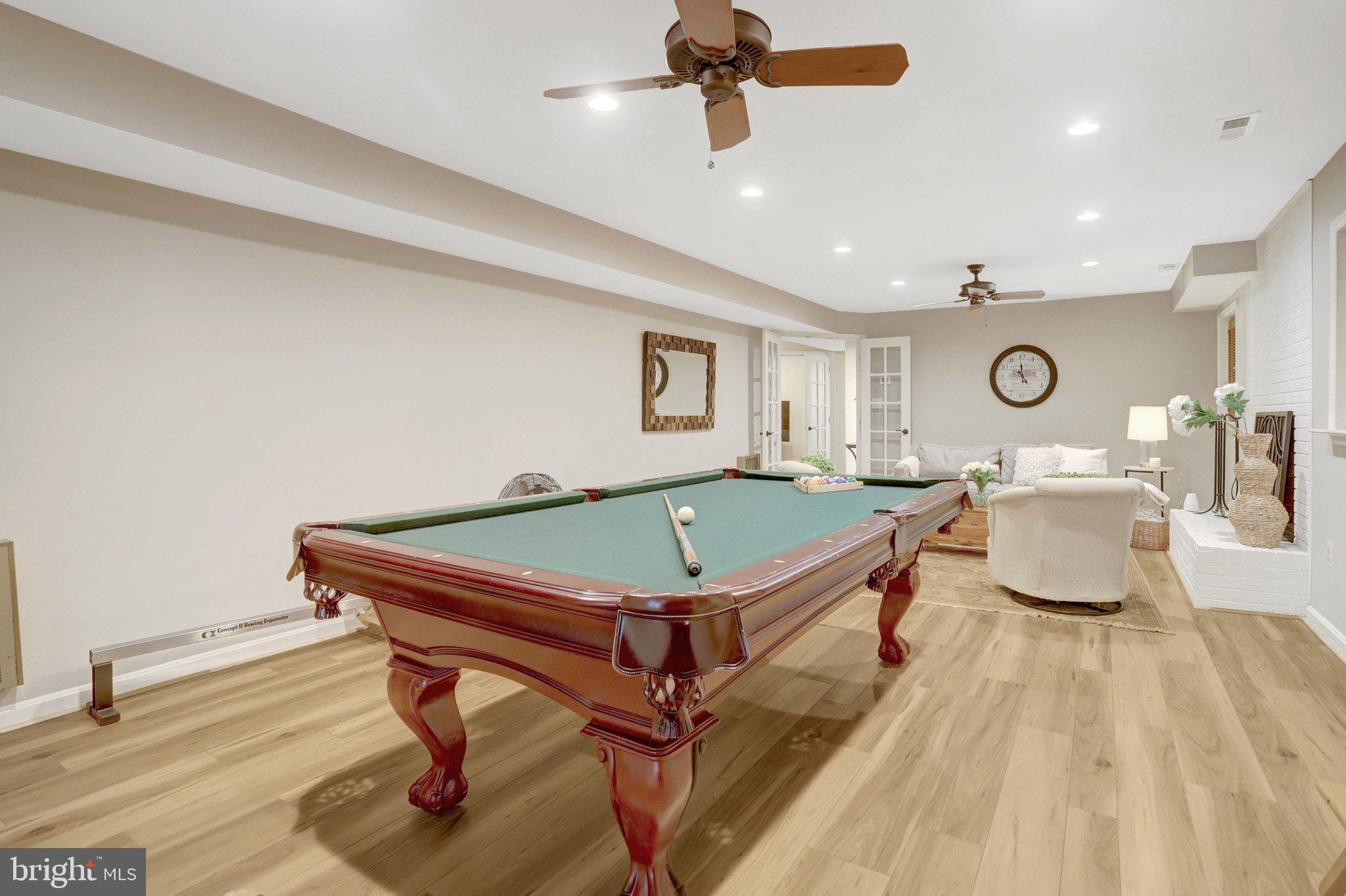 7506 Oriole Avenue Springfield, VA 22150 - Photo 36 of 67 a living room with a table tennis pool table and a couch