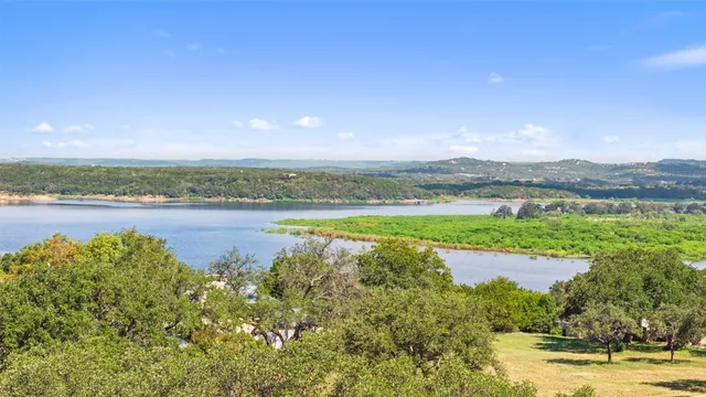 a swimming pool with outdoor seating and yard