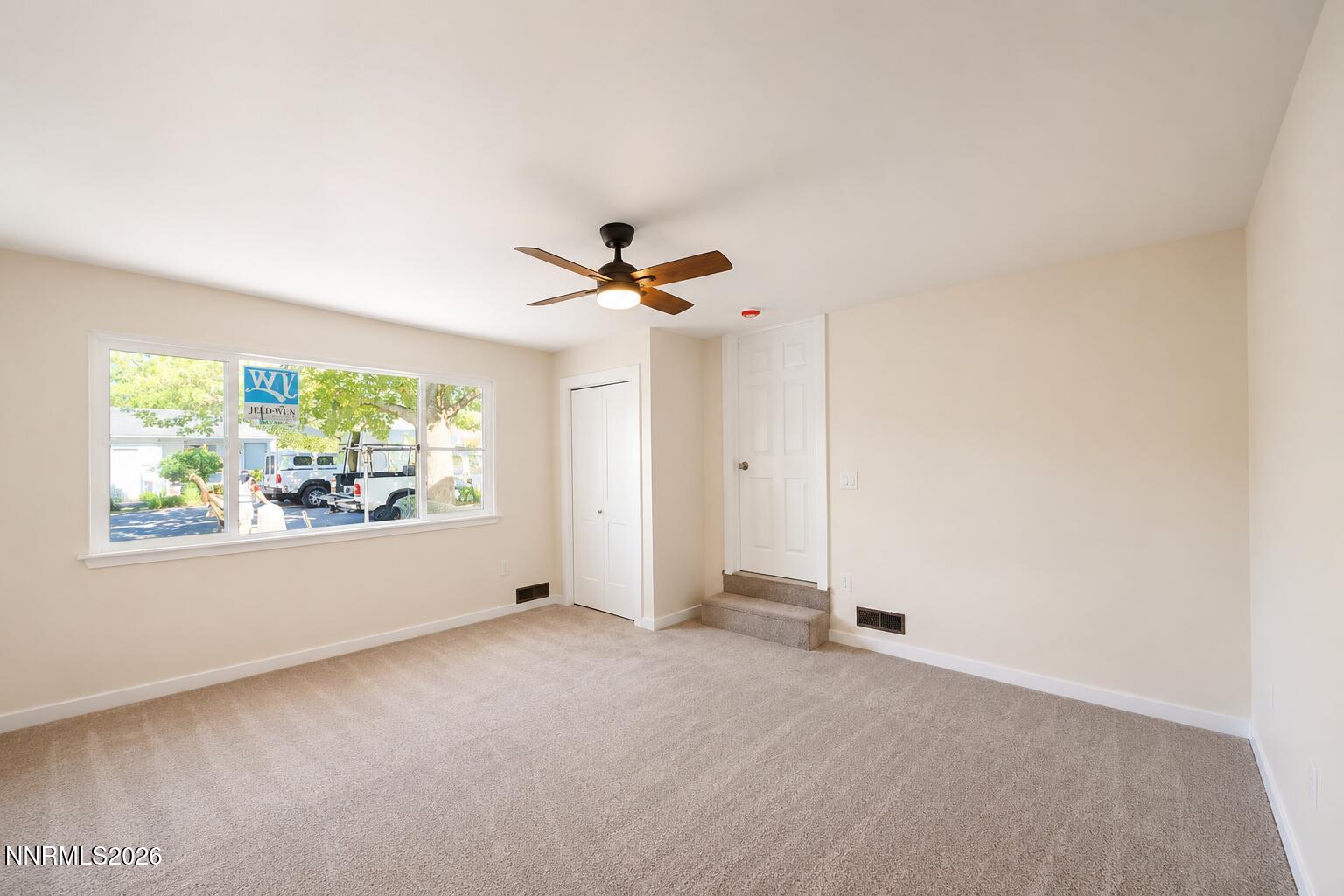 742 Ruth Street Carson City, NV 89701 - Photo 20 of 25 an empty room with windows and closet