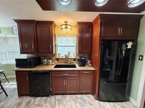 a kitchen with a sink and cabinets