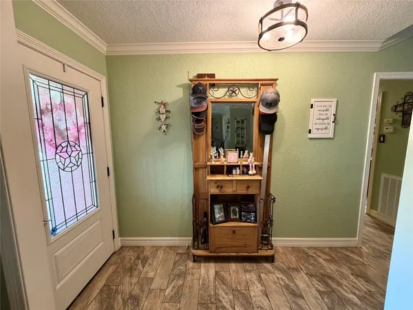 a room with window and flowerpot