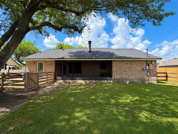a view of a house with swimming pool and a yard