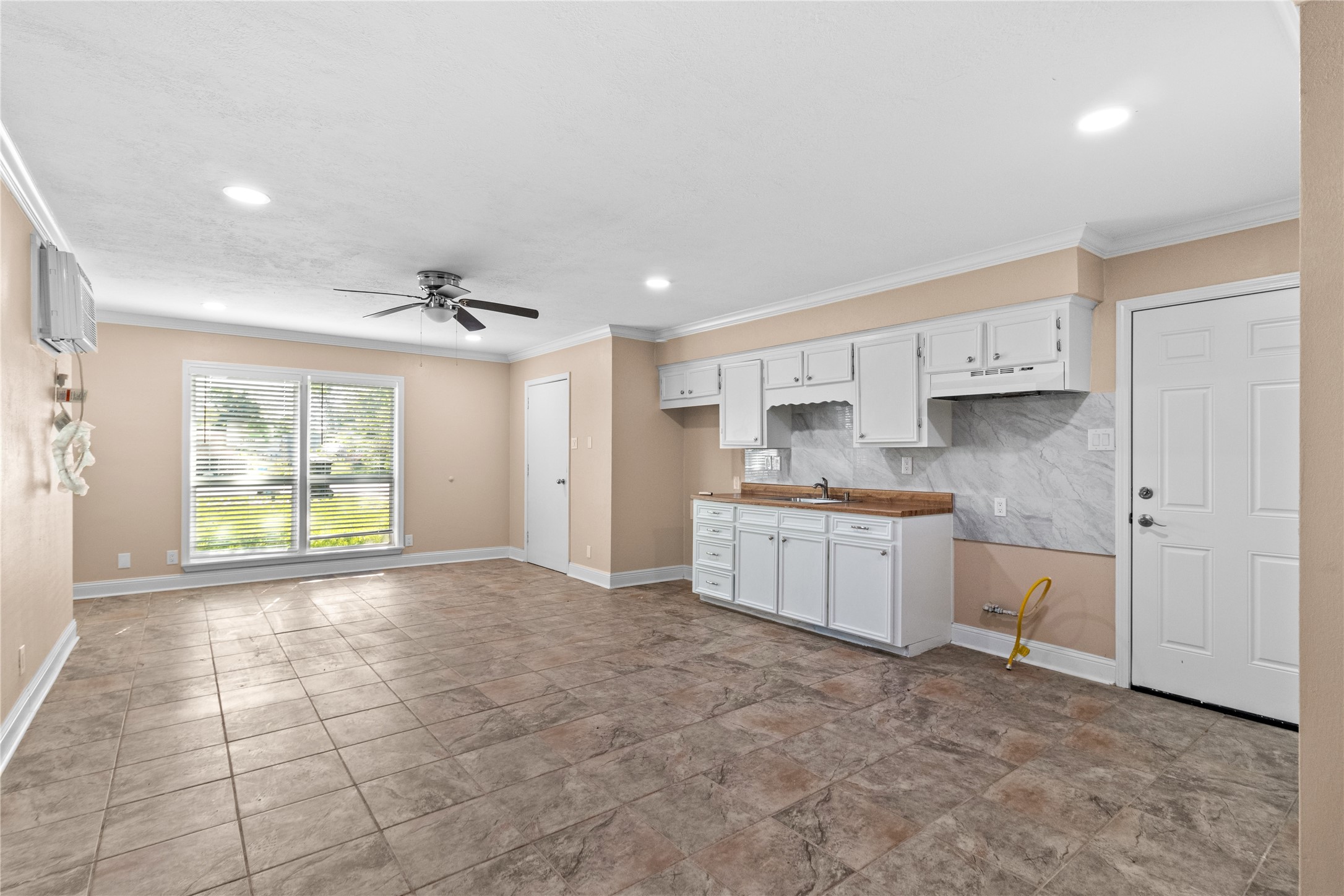 4201 Sevan Street Bacliff, TX 77518 - Photo 17 of 22 a kitchen with a refrigerator and window