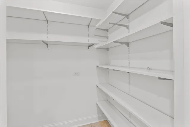 a view of an empty walk in closet