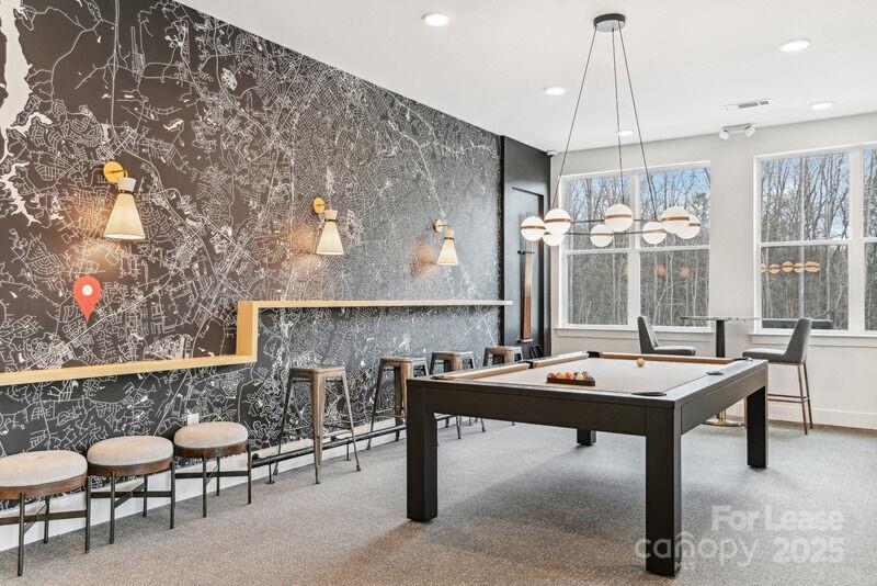 13511 Montoy Way, Unit A2 Charlotte, NC 28273 - Photo 22 of 34 a room with furniture a table and white walls