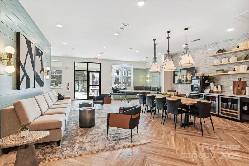 13511 Montoy Way, Unit A2 Charlotte, NC 28273 - Photo 29 of 34 a living room with lots of furniture and a large window