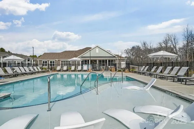 a view of a swimming pool with a chairs