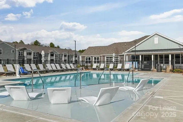 a view of a patio with couches chairs and potted plants