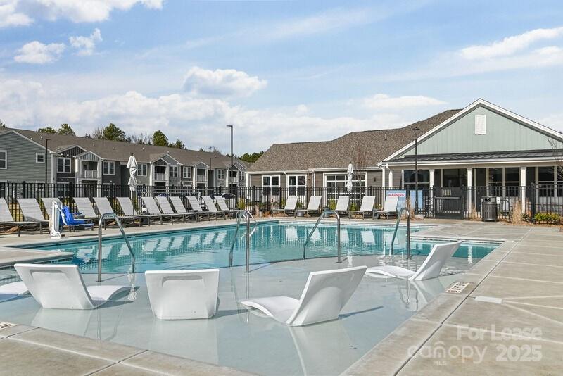 13511 Montoy Way, Unit A2 Charlotte, NC 28273 - Photo 32 of 34 a view of a patio with couches chairs and potted plants