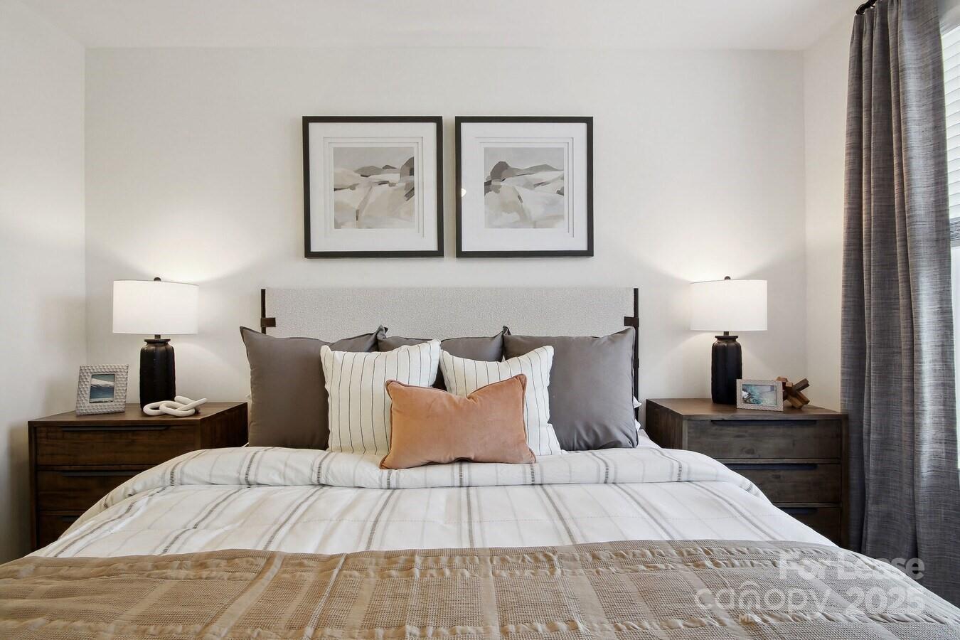 13511 Montoy Way, Unit A2 Charlotte, NC 28273 - Photo 6 of 34 a bed room with a bed and painting on the wall