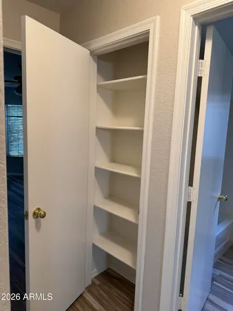 a kitchen with stainless steel appliances granite countertop a sink a stove top oven a counter space and cabinets