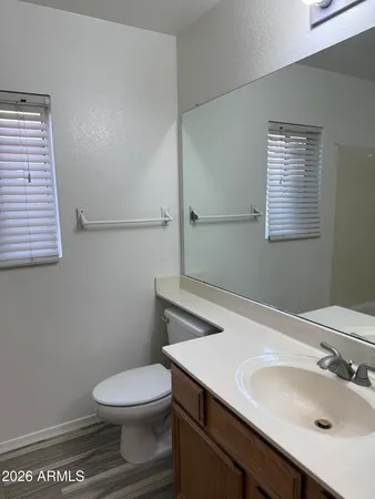 a large kitchen with a sink and a stove top oven