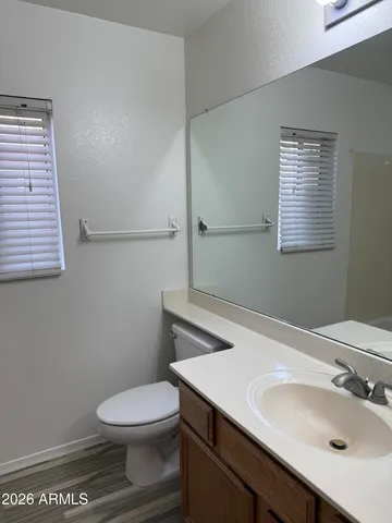a large kitchen with a sink and a stove top oven