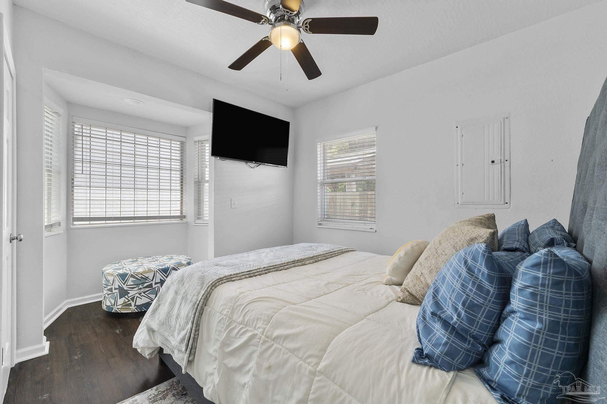 306 South N Street Pensacola, FL 32502 - Photo 16 of 37 a bedroom with a large bed and a window