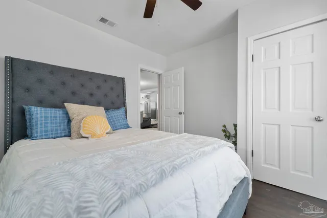 a large bed in a white room