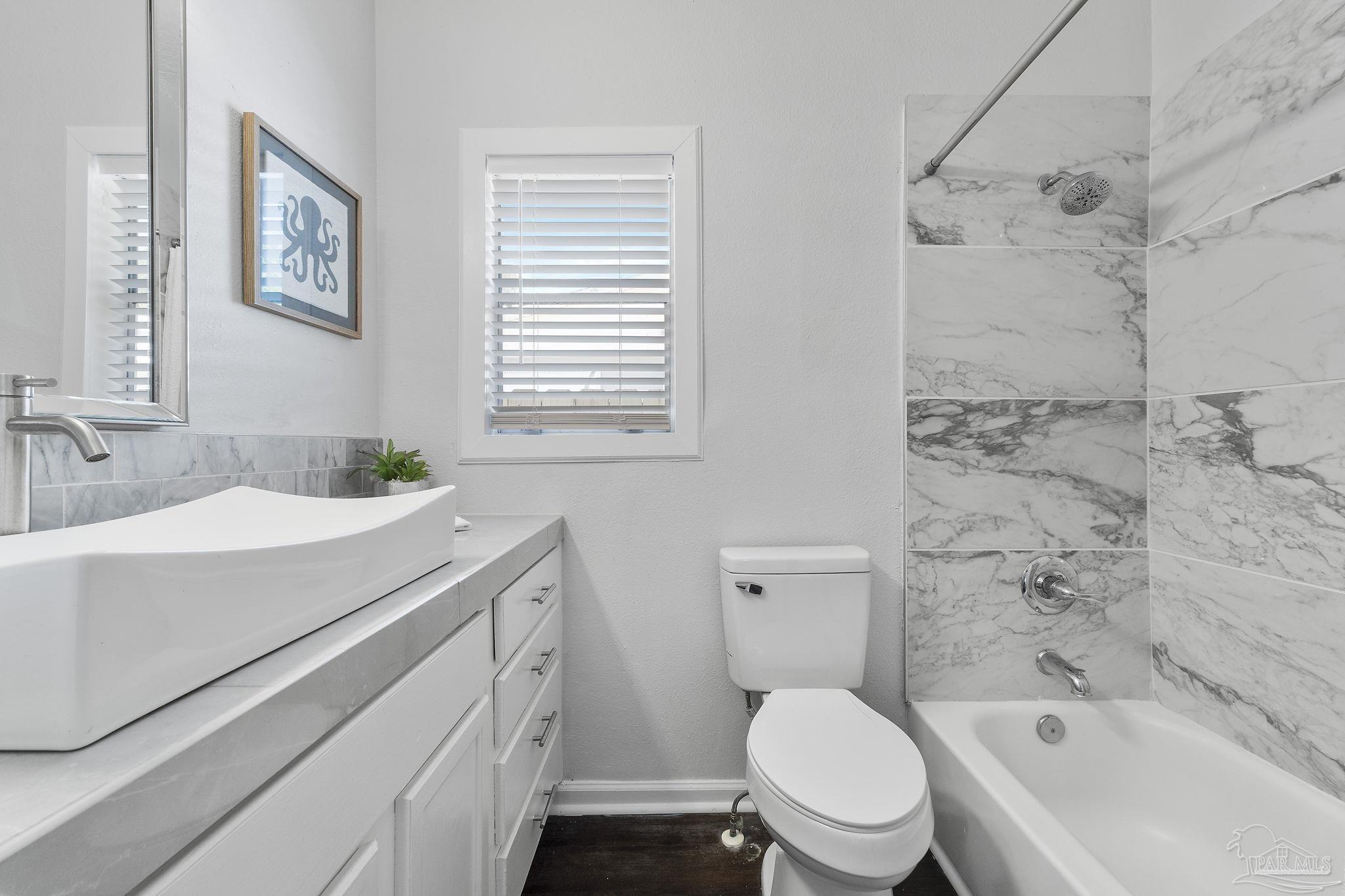 306 South N Street Pensacola, FL 32502 - Photo 18 of 37 a bathroom with a sink toilet and shower