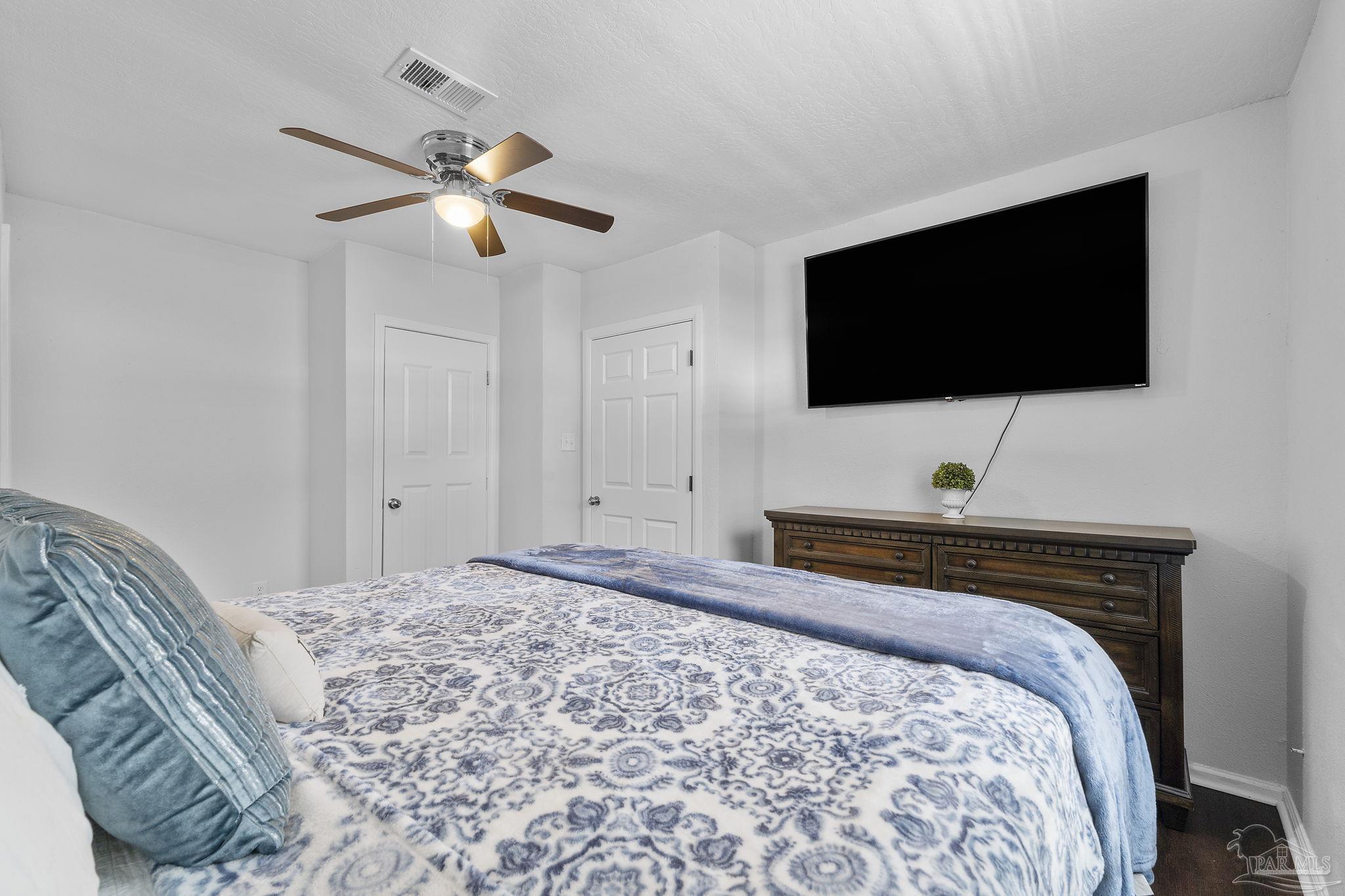 306 South N Street Pensacola, FL 32502 - Photo 22 of 37 a bedroom with a bed and a flat screen tv