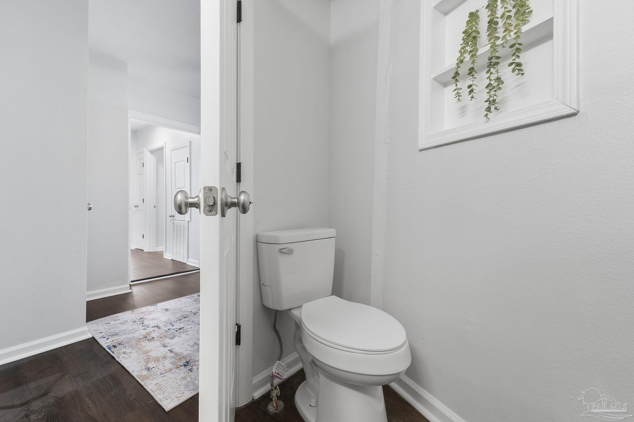 306 South N Street Pensacola, FL 32502 - Photo 24 of 37 a bathroom with a toilet and a shower