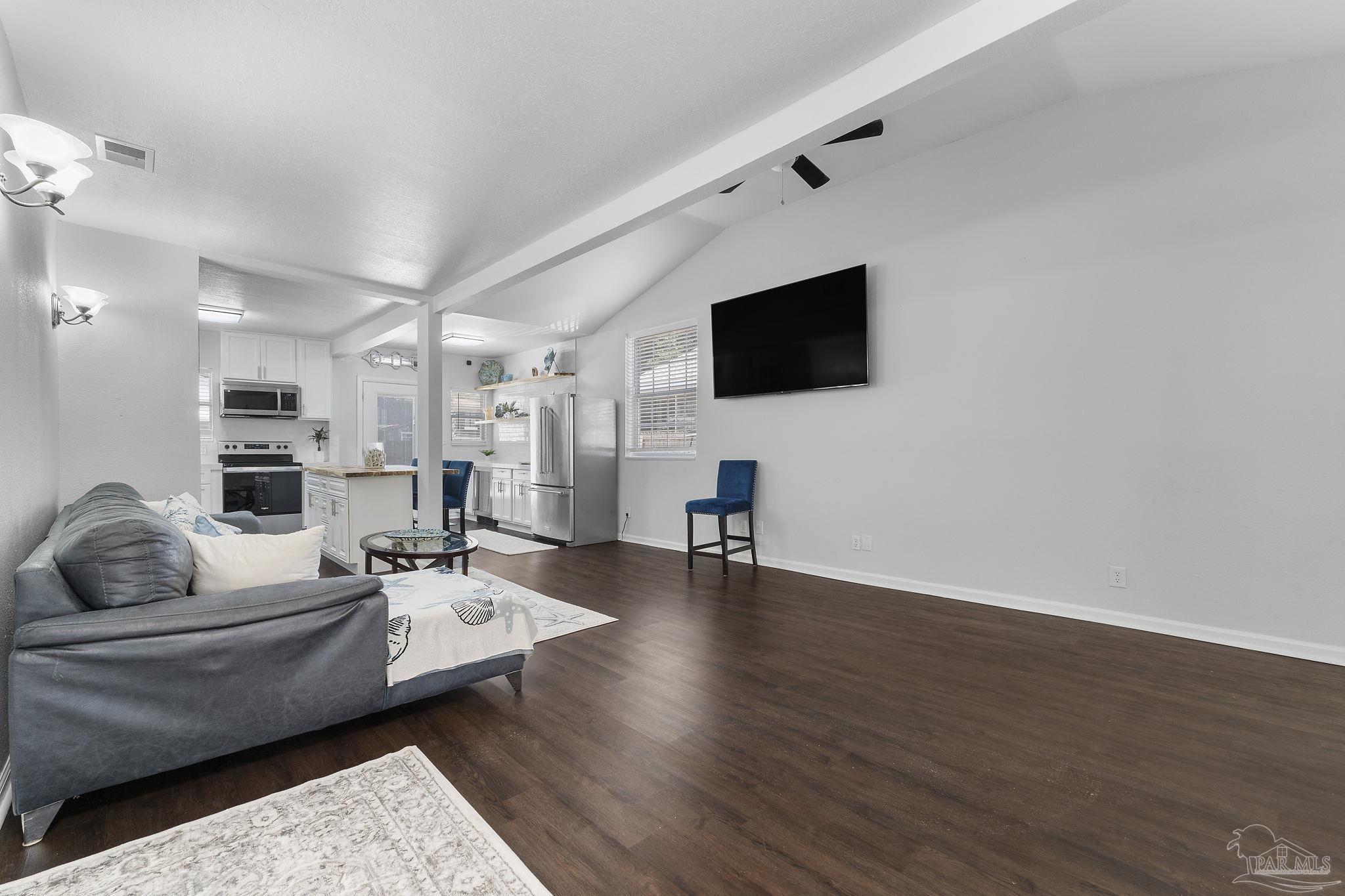 306 South N Street Pensacola, FL 32502 - Photo 28 of 37 a living room with furniture and a flat screen tv