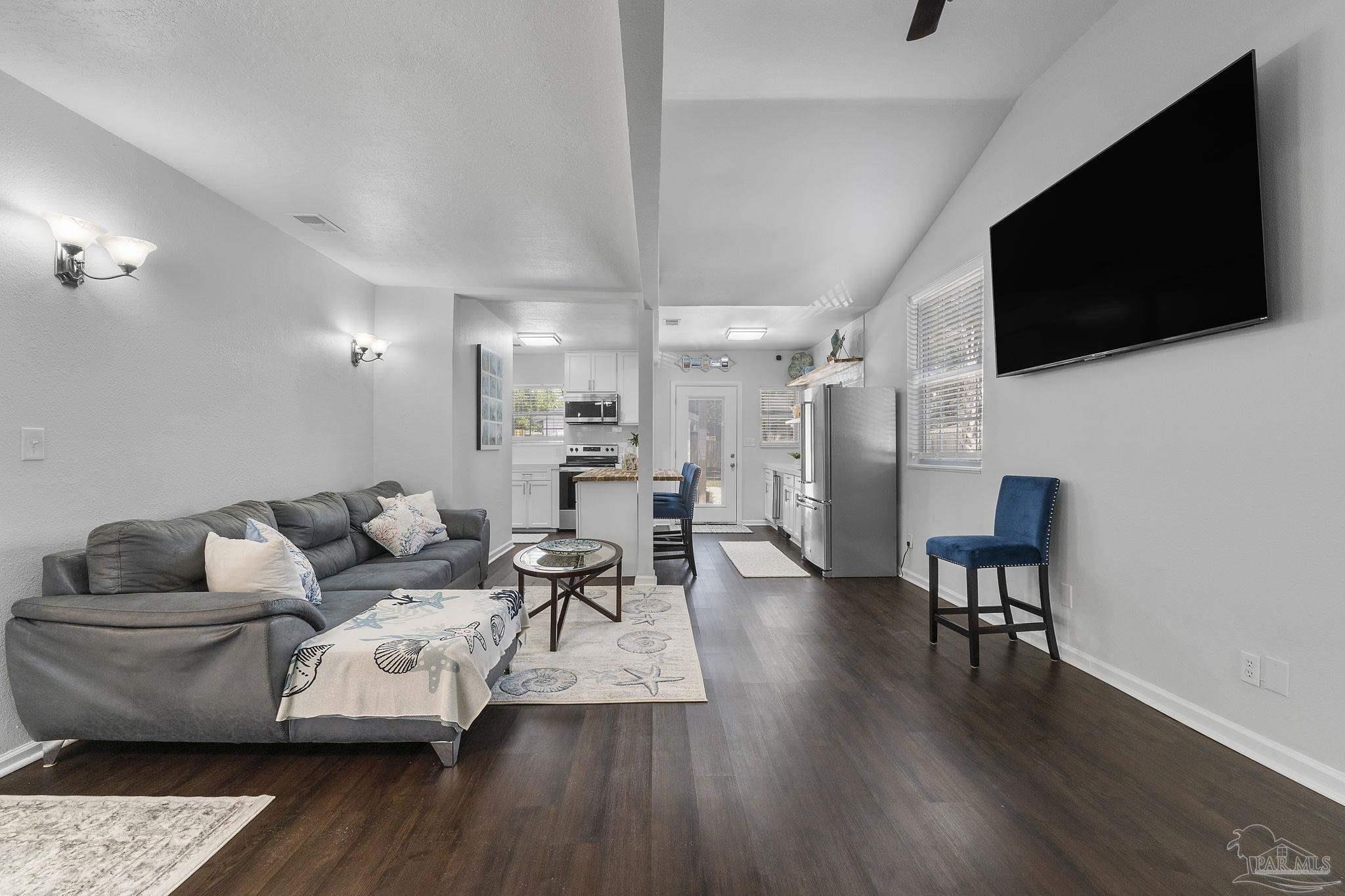 306 South N Street Pensacola, FL 32502 - Photo 29 of 37 a living room with furniture and a flat screen tv