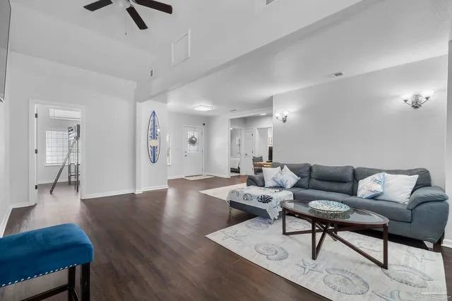 a kitchen with granite countertop a stove cabinets and wooden floor