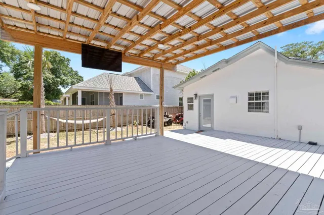 a front view of a house with yard and balcony