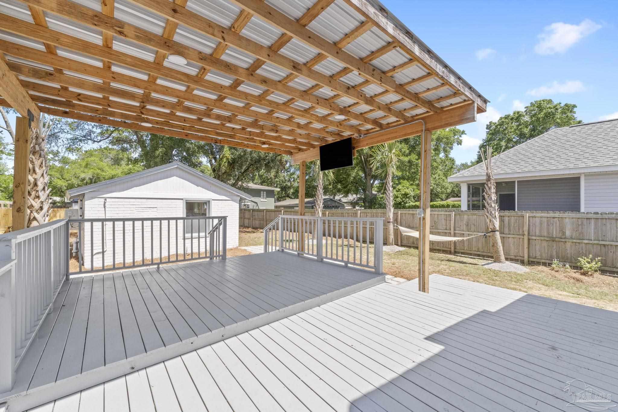 306 South N Street Pensacola, FL 32502 - Photo 6 of 37 a view of a backyard with a deck and wooden floor