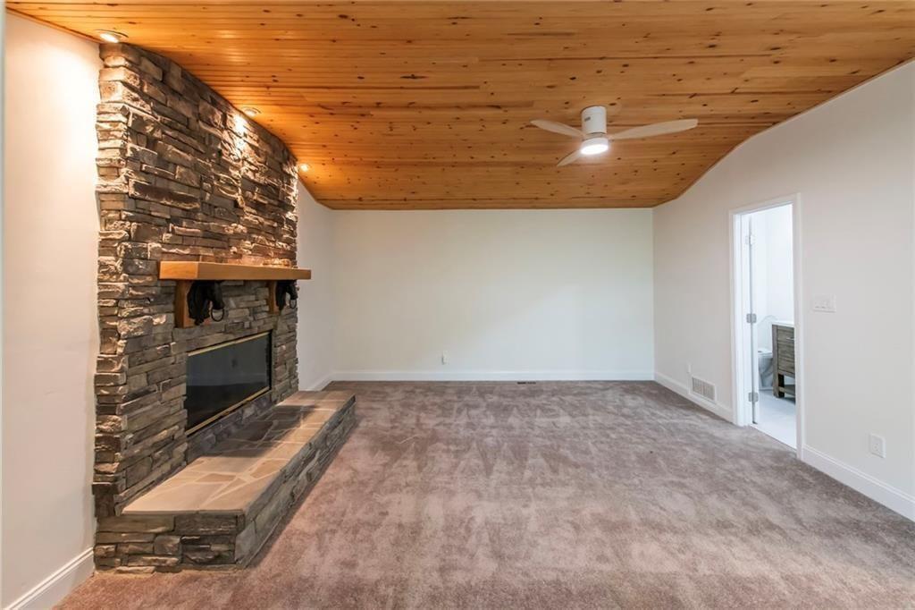 3819 Mason Creek Road Winston, GA 30187 - Photo 16 of 54 a view of an empty room with a fireplace