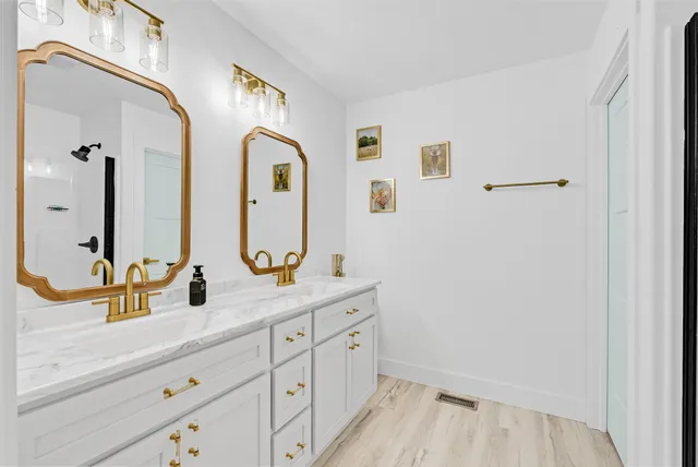 a bathroom with a tub and shower curtain