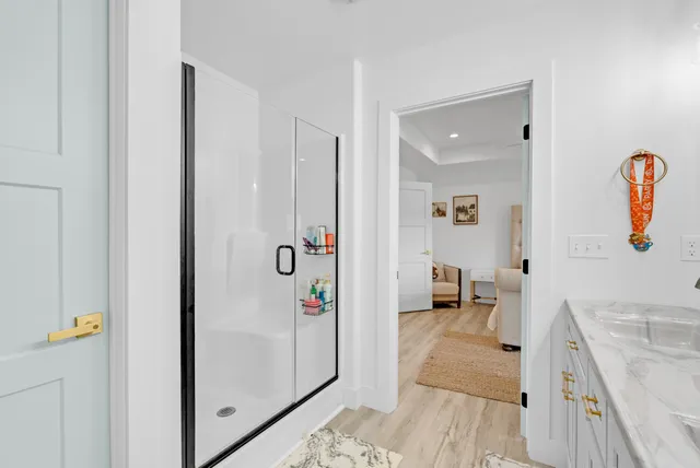 a view of walk in closet with clothes