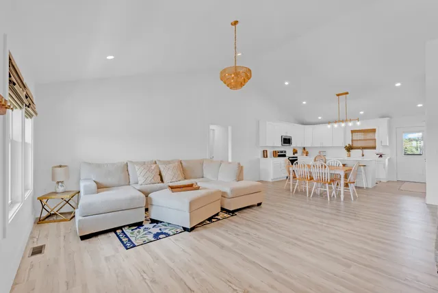 a living room with furniture and a table
