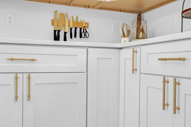 a kitchen with a table and chairs in it