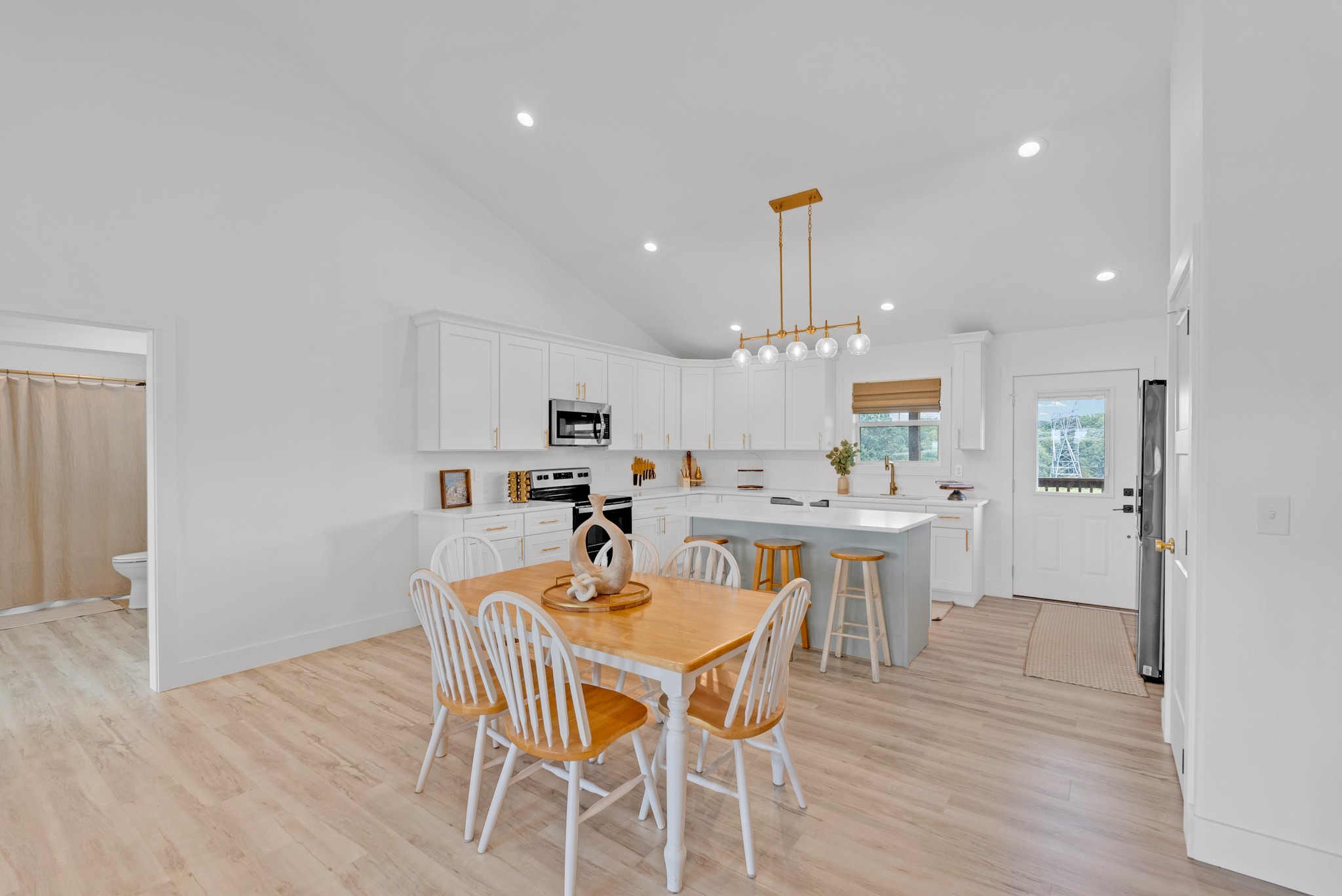 4733 Window Cliff Road Baxter, TN 38544 - Photo 9 of 25 a view of a dining room with furniture and wooden floor