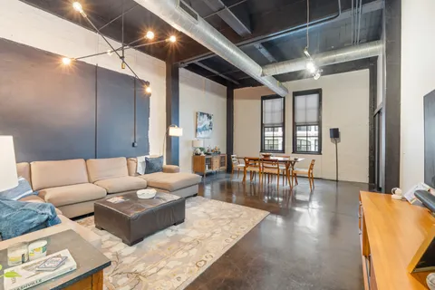 a living room with furniture and a table