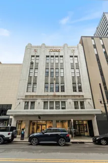 a front view of a building with glass windows