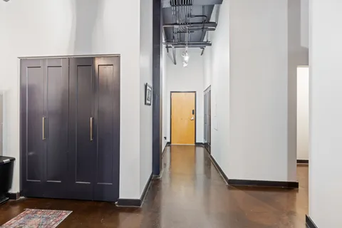 a view of a room with wooden floor