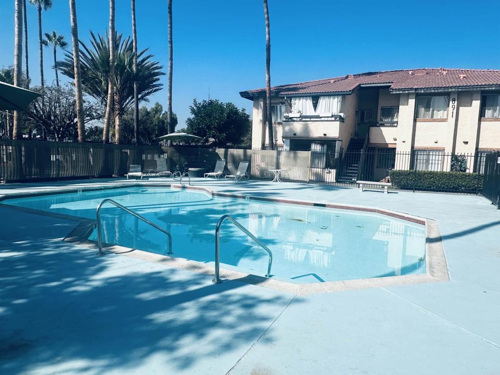891 West San Ysidro Boulevard, Unit 9 San Ysidro, CA 92173 - Photo 16 of 18 a view of a house with a swimming pool