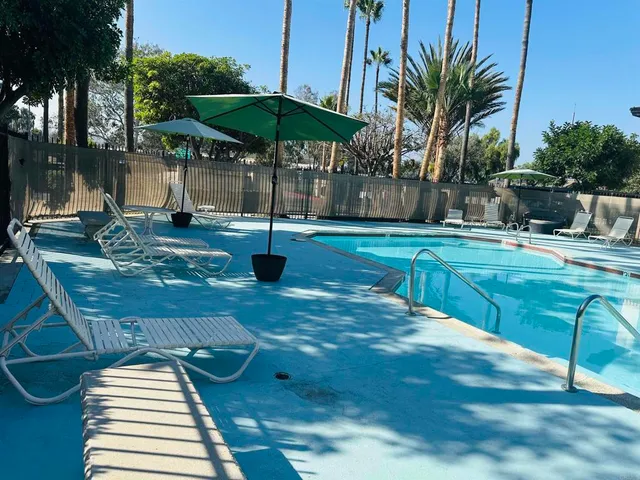 a view of a backyard with sitting area