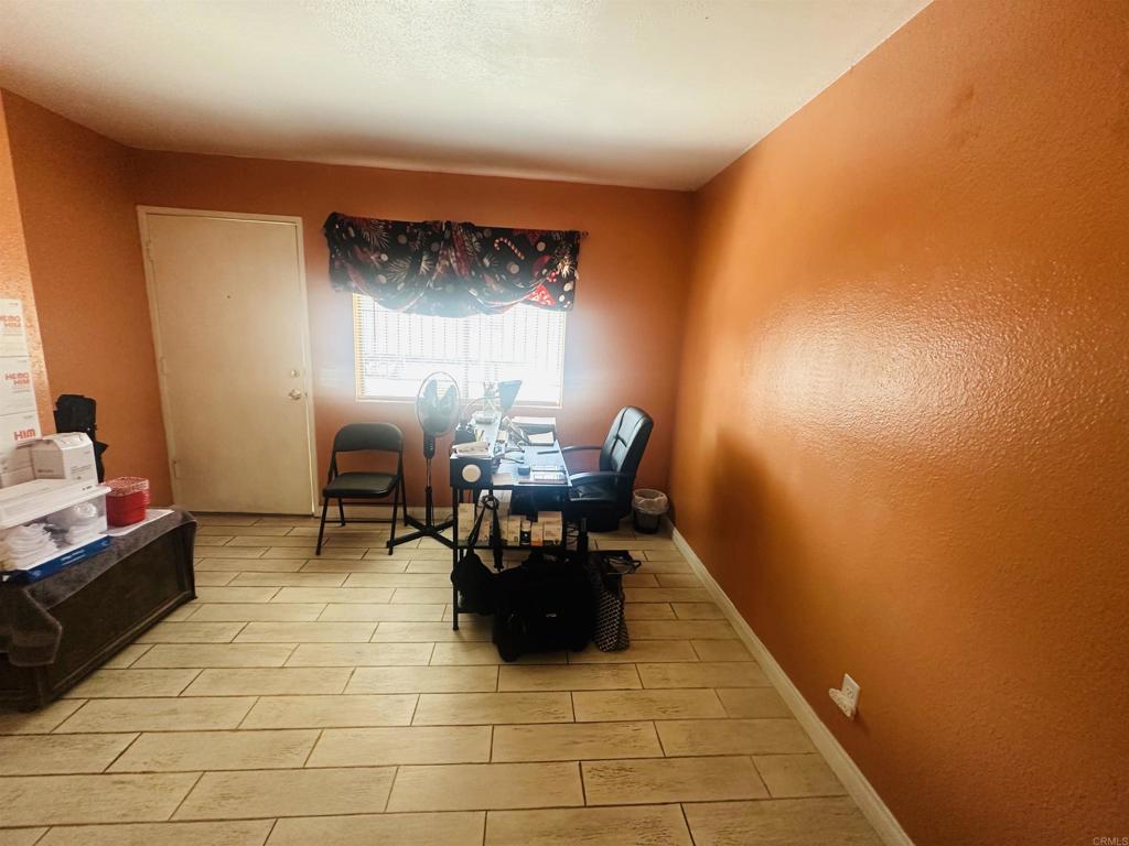 891 West San Ysidro Boulevard, Unit 9 San Ysidro, CA 92173 - Photo 3 of 18 a room with chairs